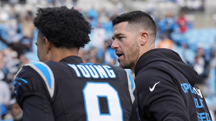Carolina Panthers head coach Dave Canales greets quarterback Bryce Young 
