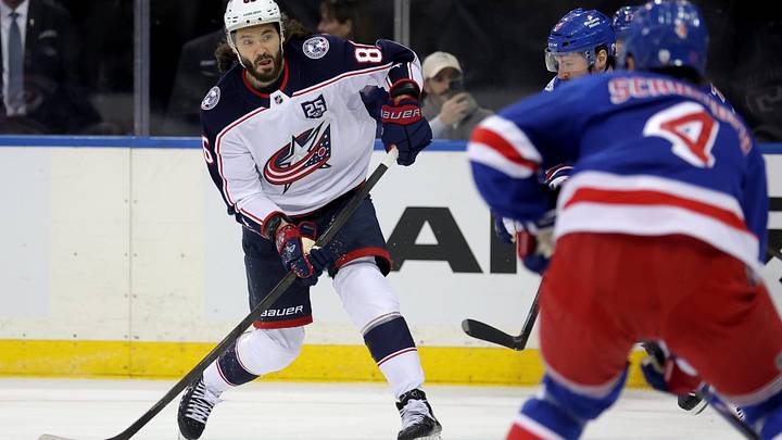 Mar 2, 2026; New York, New York, USA; Columbus Blue Jackets right wing Kirill Marchenko (86) takes a shot against New York Rangers left wing J.T. Miller (8) and defenseman Braden Schneider (4) during the first period at Madison Square Garden. Mandatory Credit: Brad Penner-Imagn Images