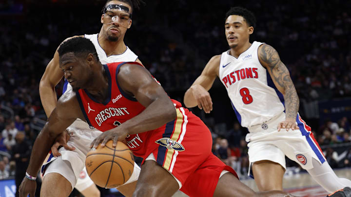 New Orleans Pelicans forward Zion Williamson (1) dribbles on Detroit Pistons forward Tosan Evbuomwan (18) in the first half at Little Caesars Arena.