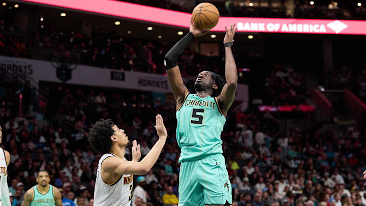 Feb 1, 2025; Charlotte, North Carolina, USA; Charlotte Hornets center Mark Williams (5) shoots over Denver Nuggets guard Julian Strawther (3) during the second half of play at Spectrum Center. Mandatory Credit: Brian Westerholt-Imagn Images Feb 1, 2025; Charlotte, North Carolina, USA; Charlotte Hornets center Mark Williams (5) shoots over Denver Nuggets guard Julian Strawther (3) during the second half of play at Spectrum Center. Mandatory Credit: Brian Westerholt-Imagn Images