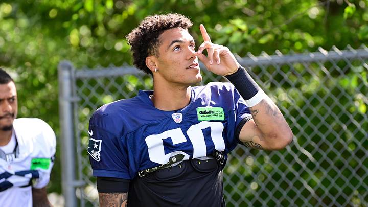 Aug 3, 2023; Foxborough, MA, USA; New England Patriots cornerback Christian Gonzalez (50) heads to the practice fields at training camp at Gillette Stadium.  Mandatory Credit: Eric Canha-Imagn Images