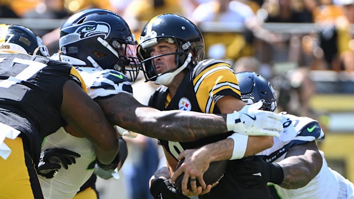 Sep 14, 2025; Pittsburgh, Pennsylvania, USA; Seattle Seahawks defensive end Leonard Williams (99) and defensive tackle Byron Murphy II (91) sack Pittsburgh Steelers quarterback Aaron Rodgers (8) during the second quarter at Acrisure Stadium.