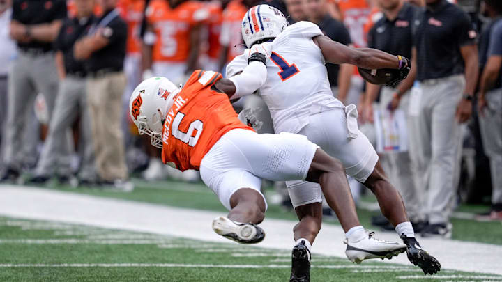 Oklahoma State linebacker Bryan McCoy Jr. (6) takes down Tennessee Martin running back John Gentry (1) in the first quarter during an NCAA football game between Oklahoma State (OSU) and UT Martin in Stillwater, Okla., on Thursday, Aug. 28, 2025.