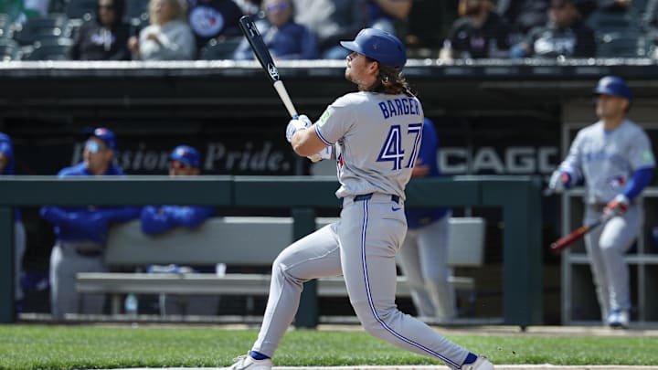 Apr 3, 2026; Chicago, Illinois, USA; Toronto Blue Jays right fielder Addison Barger (47) hits a double against the Chicago White Sox during the second inning at Rate Field. Mandatory Credit: Kamil Krzaczynski-Imagn Images