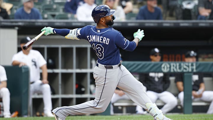 Apr 16, 2026; Chicago, Illinois, USA; Tampa Bay Rays third baseman Junior Caminero (13) hits a solo home run against the Chicago White Sox during the ninth inning at Rate Field.