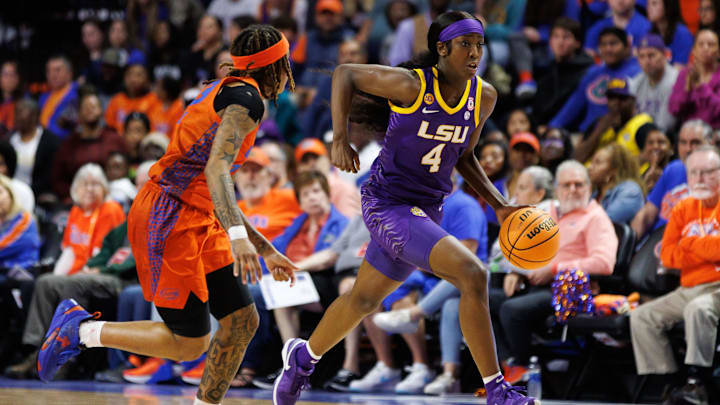 Jan 19, 2025; Gainesville, Florida, USA; LSU Tigers guard Flau'Jae Johnson (4) dribbles the ball while Florida Gators guard Liv McGill (23) defends during the second half at Exactech Arena at the Stephen C. O'Connell Center. Mandatory Credit: Matt Pendleton-Imagn Images Jan 19, 2025; Gainesville, Florida, USA; LSU Tigers guard Flau'Jae Johnson (4) dribbles the ball while Florida Gators guard Liv McGill (23) defends during the second half at Exactech Arena at the Stephen C. O'Connell Center. Mandatory Credit: Matt Pendleton-Imagn Images