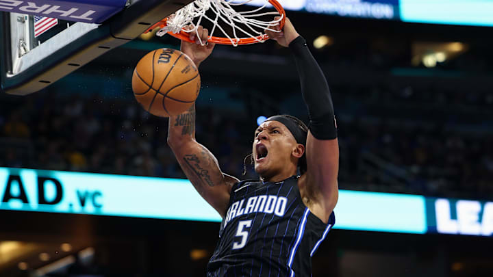 Orlando Magic forward Paolo Banchero (5) dunks the ball against the Indiana Pacers in the first quarter at Kia Center.
