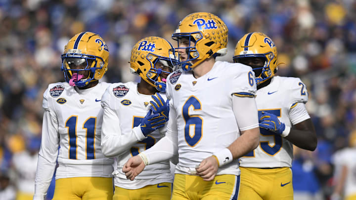 Dec 27, 2025; Annapolis, MD, USA; Pittsburgh Panthers quarterback Mason Heintschel (6) takes the field with teammates during the first half of the Military Bowl against the East Carolina Pirates at Navy-Marine Corps Stadium. Mandatory Credit: Tommy Gilligan-Imagn Images