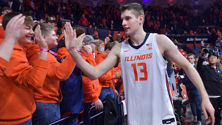 Feb 2, 2025; Champaign, Illinois, USA; Illinois Fighting Illini center Tomislav Ivisic (13) gets a hand from fans after an 87-79 win over the Ohio State Buckeyes at State Farm Center. Mandatory Credit: Ron Johnson-Imagn Images
