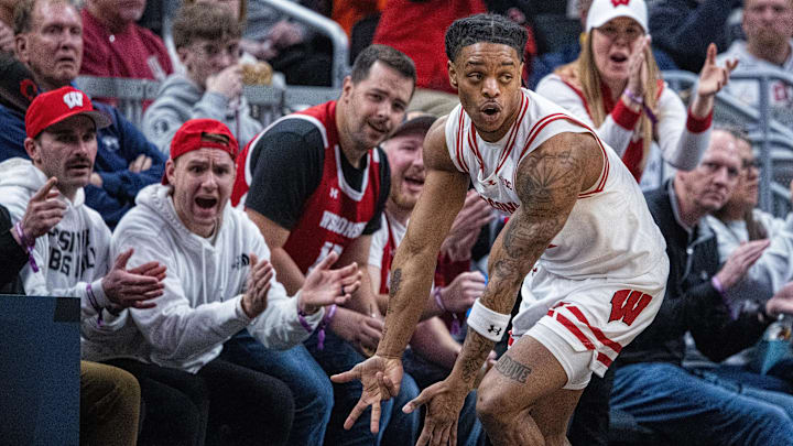 Mar 13, 2025; Indianapolis, IN, USA; Wisconsin Badgers guard Kamari McGee (4) celebrates a made basket in the first half against the Northwestern Wildcats at Gainbridge Fieldhouse. Mandatory Credit: Trevor Ruszkowski-Imagn Images