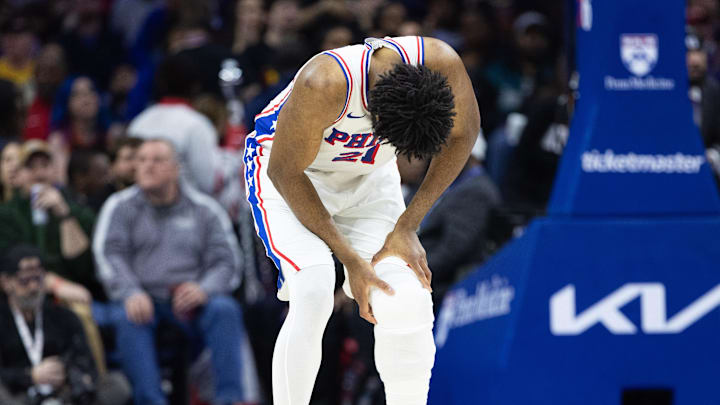 Feb 22, 2025; Philadelphia, Pennsylvania, USA; Philadelphia 76ers center Joel Embiid (21) holds his leg after a play against the Brooklyn Nets during the second quarter at Wells Fargo Center. Mandatory Credit: Bill Streicher-Imagn Images Feb 22, 2025; Philadelphia, Pennsylvania, USA; Philadelphia 76ers center Joel Embiid (21) holds his leg after a play against the Brooklyn Nets during the second quarter at Wells Fargo Center. Mandatory Credit: Bill Streicher-Imagn Images
