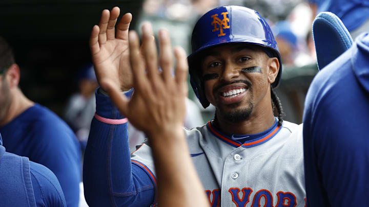 Apr 17, 2026; Chicago, Illinois, USA; New York Mets shortstop Francisco Lindor (12) celebrates with teammates after scoring against the Chicago Cubs during the eight inning at Wrigley Field. Mandatory Credit: Kamil Krzaczynski-Imagn Images