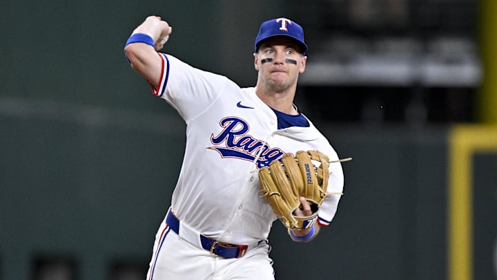 May 1, 2025; Arlington, Texas, USA; Texas Rangers third baseman Josh Jung (6) throws out Athletics catcher Jhonny Pereda (not pictured) during the fifth inning at Globe Life Field. 