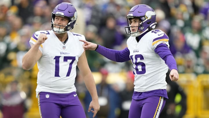 Nov 23, 2025; Green Bay, Wisconsin, USA; Minnesota Vikings place kicker Will Reichard (16) reacts with punter Ryan Wright (17) after kicking a field goal against the Green Bay Packers during the first half at Lambeau Field.
