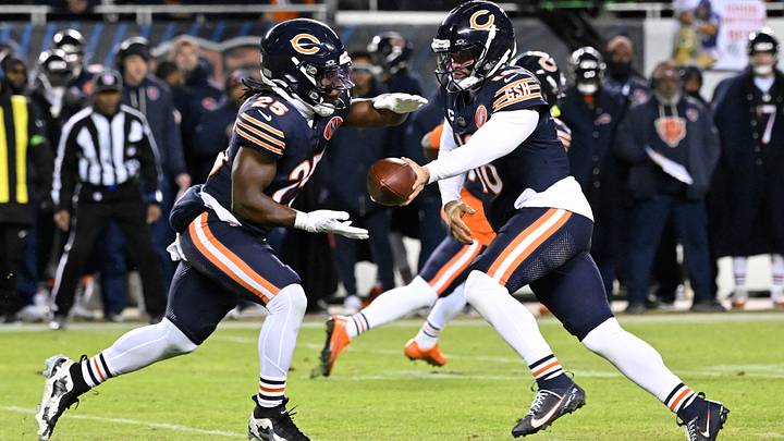 Chicago Bears quarterback Caleb Williams (18) hands off to running back Kyle Monangai (25) against the Green Bay Packers during the first half of an NFC Wild Card Round game at Soldier Field. Mandatory Credit: Matt Marton-Imagn Images