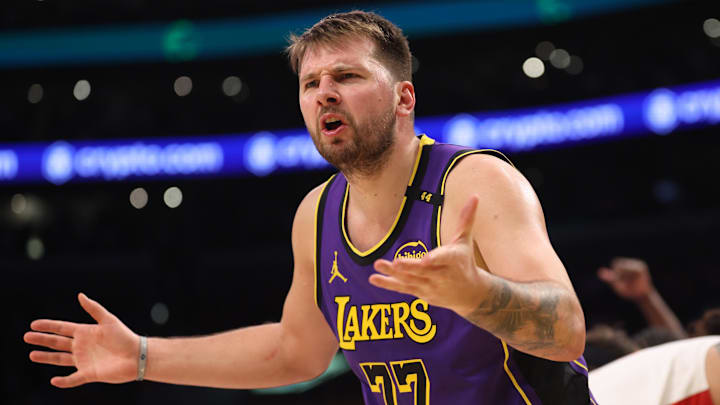 Mar 31, 2025; Los Angeles, California, USA;  Los Angeles Lakers guard Luka Doncic (77) reacts to a play during the third quarter against the Houston Rockets at Crypto.com Arena. Mandatory Credit: Kiyoshi Mio-Imagn Images