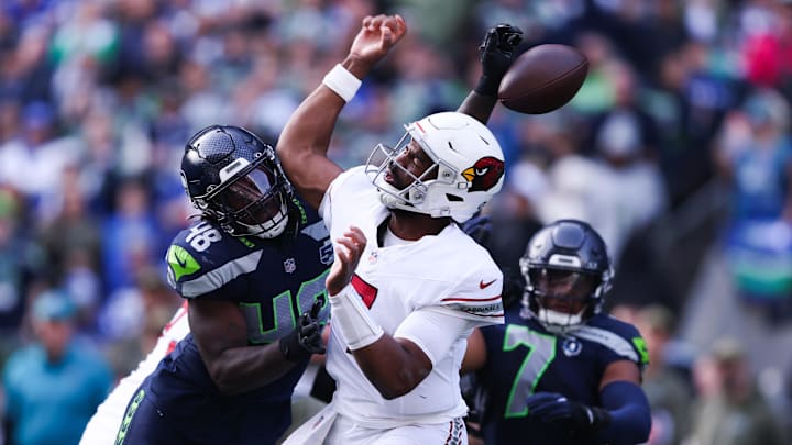 Nov 9, 2025; Seattle, Washington, USA; Arizona Cardinals quarterback Jacoby Brissett (7) fumbles the ball as Seattle Seahawks linebacker Tyrice Knight (48) defends during the second quarter at Lumen Field. Nov 9, 2025; Seattle, Washington, USA; Arizona Cardinals quarterback Jacoby Brissett (7) fumbles the ball as Seattle Seahawks linebacker Tyrice Knight (48) defends during the second quarter at Lumen Field.