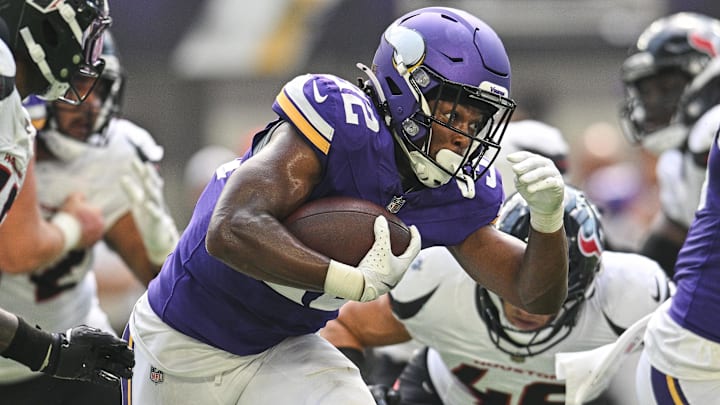 Aug 9, 2025; Minneapolis, Minnesota, USA; Minnesota Vikings running back Ty Chandler (32) runs the ball against the Houston Texans during the second quarter at U.S. Bank Stadium.