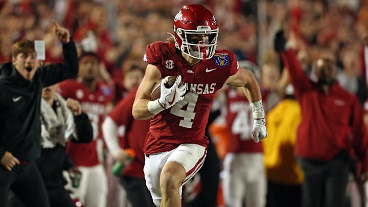 Arkansas Razorbacks wide receiver Isaac TeSlaa (4) runs after a catch for a first down during the first quarter against the Texas Tech Red Raiders at Simmons Bank Liberty Stadium. 