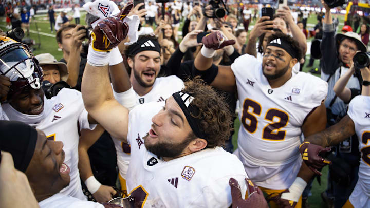 Nov 30, 2024; Tucson, Arizona, USA; Arizona State Sun Devils running back Cam Skattebo (4) celebrates after defeating the Arizona Wildcats during the Territorial Cup at Arizona Stadium. Mandatory Credit: Mark J. Rebilas-Imagn Images
