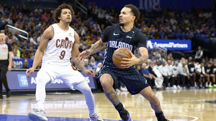 Orlando Magic guard Cole Anthony (50) drives to the basket as Cleveland Cavaliers guard Craig Porter Jr. (9) defends in the first half at Kia Center.