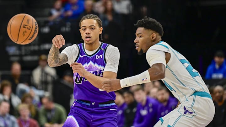 Jan 10, 2026; Salt Lake City, Utah, USA; Utah Jazz guard Keyonte George (3) makes a quick pass around Charlotte Hornets forward Brandon Miller (24) during the first half at Delta Center. Mandatory Credit: Peter Creveling-Imagn Images