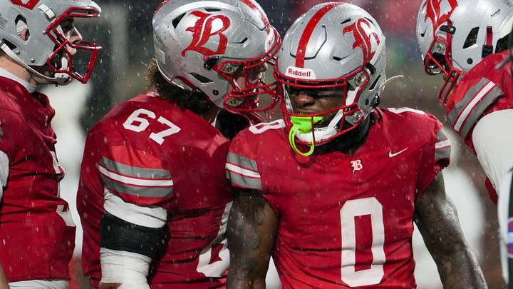 Teammates celebrate with Baylor's David Gabriel Georges (0) as he scores a touchdown during the Division II-AAA Championship match between Baylor versus. Brentwood Academy in Finley Stadium, Chattanooga, Tenn., on Thursday, Dec. 4, 2025.