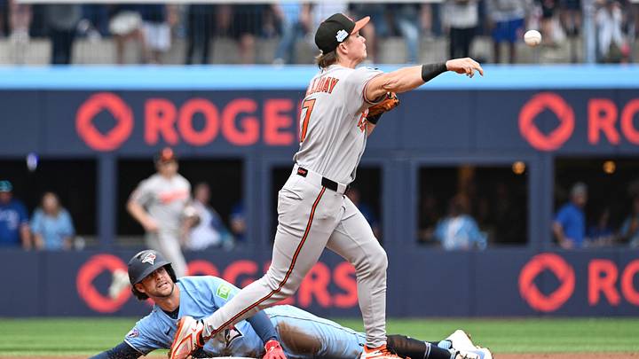 Jun 7, 2026; Toronto, Ontario, CAN; Baltimore Orioles second baseman Jackson Holliday (7) throws to first base but cannot turn a double play after forcing out Toronto Blue Jays second baseman Ernie Clement (22) in the second inning at Rogers Centre. Mandatory Credit: Dan Hamilton-Imagn Images Jun 7, 2026; Toronto, Ontario, CAN; Baltimore Orioles second baseman Jackson Holliday (7) throws to first base but cannot turn a double play after forcing out Toronto Blue Jays second baseman Ernie Clement (22) in the second inning at Rogers Centre. Mandatory Credit: Dan Hamilton-Imagn Images