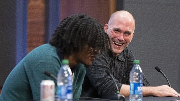 May 4, 2023; Owings Mills, MD, USA; Baltimore Ravens general manager Eric DeCosta reacts to quarterback Lamar Jackson during a press conference at Under Armour Performance Center. Mandatory Credit: Brent Skeen-Imagn Images May 4, 2023; Owings Mills, MD, USA; Baltimore Ravens general manager Eric DeCosta reacts to quarterback Lamar Jackson during a press conference at Under Armour Performance Center. Mandatory Credit: Brent Skeen-Imagn Images