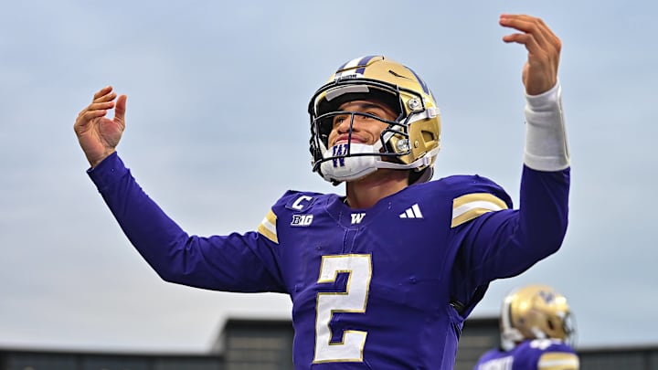 Washington Huskies quarterback Demond Williams Jr. (2) celebrates his touchdown pass to Denzel Boston during the Oregon Ducks and Washington Huskies game. Oregon defeated Washington 26-14. Washington Huskies quarterback Demond Williams Jr. (2) celebrates his touchdown pass to Denzel Boston during the Oregon Ducks and Washington Huskies game. Oregon defeated Washington 26-14.