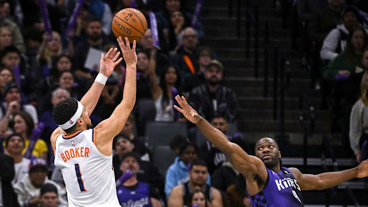 Nov 26, 2025; Sacramento, California, USA; Phoenix Suns guard Devin Booker (1) takes a shot against the Sacramento Kings during the second quarter at Golden 1 Center. Mandatory Credit: Ed Szczepanski-Imagn Images