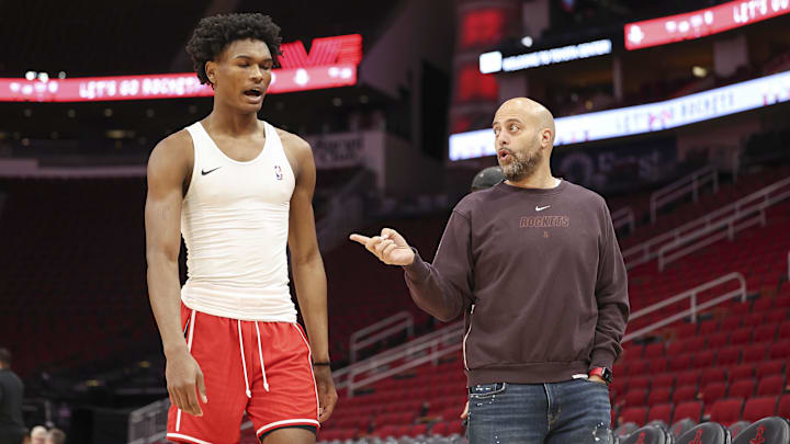 Jan 6, 2024; Houston, Texas, USA; Houston Rockets general manager Rafael Stone (right) talks with Rockets forward Amen Thompson (1) before the game against the Milwaukee Bucks at Toyota Center. Mandatory Credit: Troy Taormina-Imagn Images