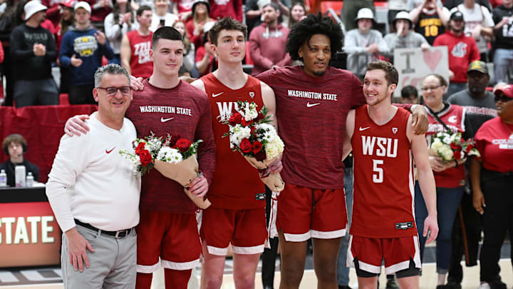 Mar 7, 2024; Pullman, Washington, USA; Washington State Cougars forward Andrej Jakimovski (23), Washington State Cougars forward AJ Rohosy (15), Washington State Cougars forward Isaac Jones (13) and Washington State Cougars guard Ben Olesen (5) pose with Washington State Cougars head coach Kyle Smith before a game against the Washington Huskies at Friel Court at Beasley Coliseum. Mandatory Credit: James Snook-Imagn Images Mar 7, 2024; Pullman, Washington, USA; Washington State Cougars forward Andrej Jakimovski (23), Washington State Cougars forward AJ Rohosy (15), Washington State Cougars forward Isaac Jones (13) and Washington State Cougars guard Ben Olesen (5) pose with Washington State Cougars head coach Kyle Smith before a game against the Washington Huskies at Friel Court at Beasley Coliseum. Mandatory Credit: James Snook-Imagn Images