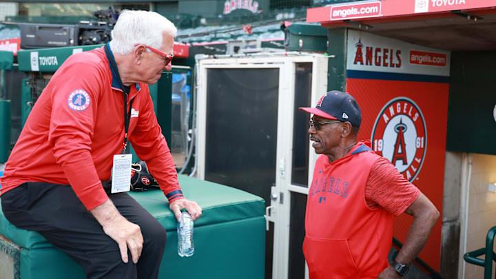 Jun 21, 2025; Anaheim, California, USA; Los Angeles Angels manager Ron Washington (37, right) talks to former MLB manager Bobby Valentine before the game against the Houston Astros at Angel Stadium. Washington is stepping indefinitely away from the team due to health reasons. Mandatory Credit: Kiyoshi Mio-Imagn Images