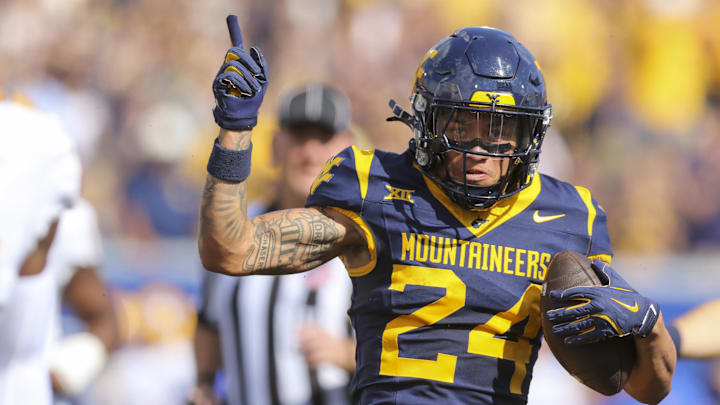 Sep 13, 2025; Morgantown, West Virginia, USA; West Virginia Mountaineers wide receiver Rodney Gallagher III (24) celebrates a first down after a catch during the first quarter against the Pittsburgh Panthers at Milan Puskar Stadium. Mandatory Credit: Ben Queen-Imagn Images