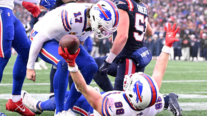 Dec 14, 2025; Foxborough, Massachusetts, USA; Buffalo Bills tight end Dawson Knox (88) celebrates with quarterback Josh Allen (17) after scoring a touchdown against the New England Patriots during the second half at Gillette Stadium.