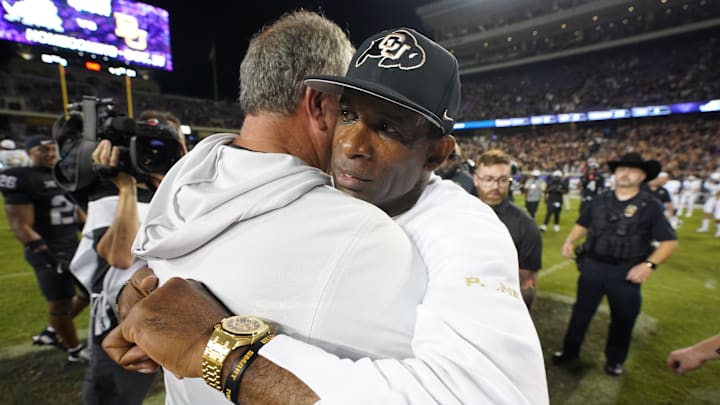 Oct 4, 2025; Fort Worth, Texas, USA; TCU Horned Frogs head coach Sonny Dykes and Colorado Buffaloes head coach Deion Sanders hug following a game at Amon G. Carter Stadium. Mandatory Credit: Raymond Carlin III-Imagn Images