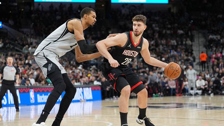 Mar 8, 2026; San Antonio, Texas, USA;  Houston Rockets center Alperen Sengun (28) dribbles against San Antonio Spurs forward Victor Wembanyama (1) in the first half at Frost Bank Center. Mandatory Credit: Daniel Dunn-Imagn Images