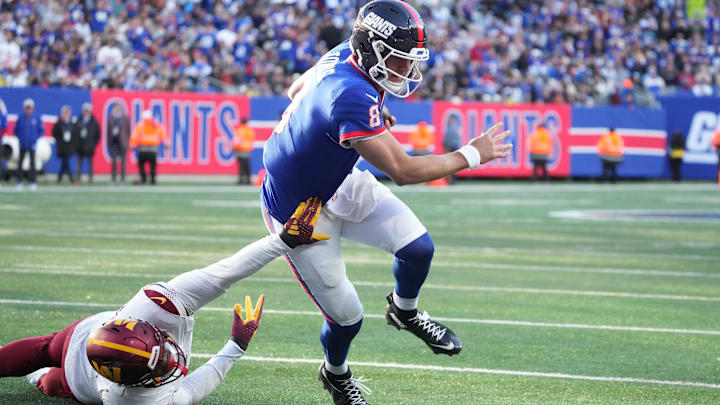 Nov 3, 2024; East Rutherford, New Jersey, USA; New York Giants quarterback Daniel Jones (8) scores a 2nd half touchdown as Washington Commanders linebacker Dante Fowler Jr. (6) defends at MetLife Stadium. Mandatory Credit: Robert Deutsch-Imagn Images Nov 3, 2024; East Rutherford, New Jersey, USA; New York Giants quarterback Daniel Jones (8) scores a 2nd half touchdown as Washington Commanders linebacker Dante Fowler Jr. (6) defends at MetLife Stadium. Mandatory Credit: Robert Deutsch-Imagn Images