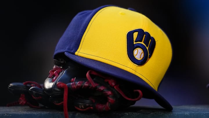 Jul 3, 2024; Denver, Colorado, USA; Detailed view of a Milwaukee Brewers cap and glove during the game against the Colorado Rockies at Coors Field. Mandatory Credit: Ron Chenoy-Imagn Images Jul 3, 2024; Denver, Colorado, USA; Detailed view of a Milwaukee Brewers cap and glove during the game against the Colorado Rockies at Coors Field. Mandatory Credit: Ron Chenoy-Imagn Images