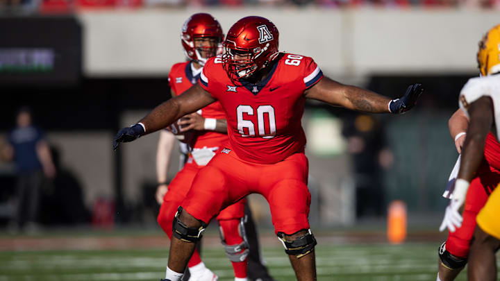 Nov 30, 2024; Tucson, Arizona, USA; Arizona Wildcats offensive lineman Alexander Doost (60) against the Arizona State Sun Devils during the Territorial Cup at Arizona Stadium. Mandatory Credit: Mark J. Rebilas-Imagn Images Nov 30, 2024; Tucson, Arizona, USA; Arizona Wildcats offensive lineman Alexander Doost (60) against the Arizona State Sun Devils during the Territorial Cup at Arizona Stadium. Mandatory Credit: Mark J. Rebilas-Imagn Images
