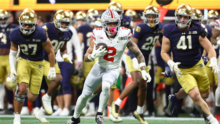 Jan 20, 2025; Atlanta, GA, USA; Ohio State Buckeyes wide receiver Emeka Egbuka (2) runs with the ball against the Notre Dame Fighting Irish during the second half the CFP National Championship college football game at Mercedes-Benz Stadium. Mandatory Credit: Mark J. Rebilas-Imagn Images Jan 20, 2025; Atlanta, GA, USA; Ohio State Buckeyes wide receiver Emeka Egbuka (2) runs with the ball against the Notre Dame Fighting Irish during the second half the CFP National Championship college football game at Mercedes-Benz Stadium. Mandatory Credit: Mark J. Rebilas-Imagn Images
