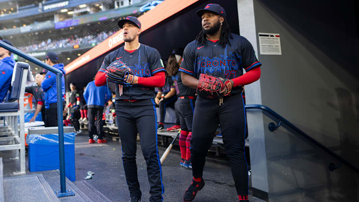 Jose Berrios and Vladimir Guerrero Jr. of the Toronto Blue Jays prepare to take the field for a 2024 game against the Pittsburgh Pirates.