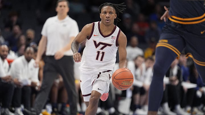 Mar 11, 2025; Virginia Tech guard Ben Hammond (11) brings the ball up court during OT against California at Spectrum Center.