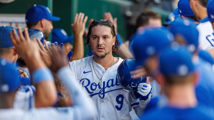 Aug 20, 2025; Kansas City, Missouri, USA;  Kansas City Royals first base Vinnie Pasquantino (9) celebrates in the dugout after hitting a home run during the first inning against the Texas Rangers at Kauffman Stadium. Mandatory Credit: William Purnell-Imagn Images