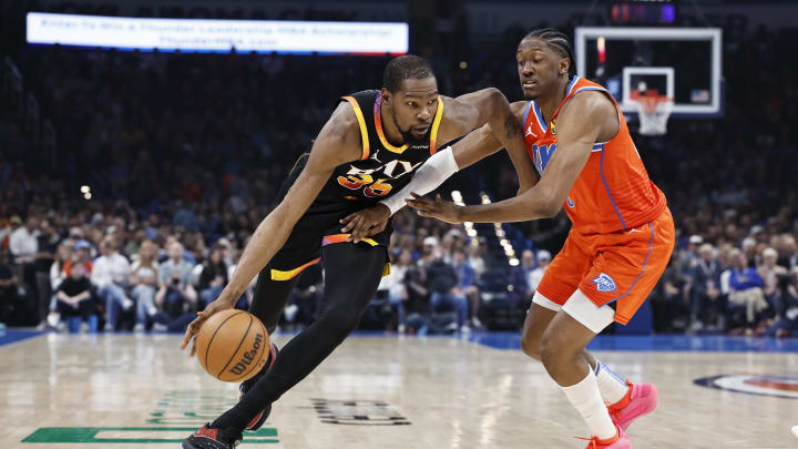Mar 29, 2024; Oklahoma City, Oklahoma, USA; Phoenix Suns forward Kevin Durant (35) moves the ball as Oklahoma City Thunder forward Jalen Williams (8) defends during the first half at Paycom Center. Mandatory Credit: Alonzo Adams-USA TODAY Sports