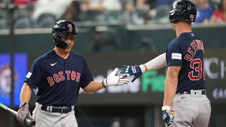 Sep 20, 2023; Arlington, Texas, USA; Boston Red Sox left fielder Masataka Yoshida (7) celebrates with Rob Refsnyder (30)