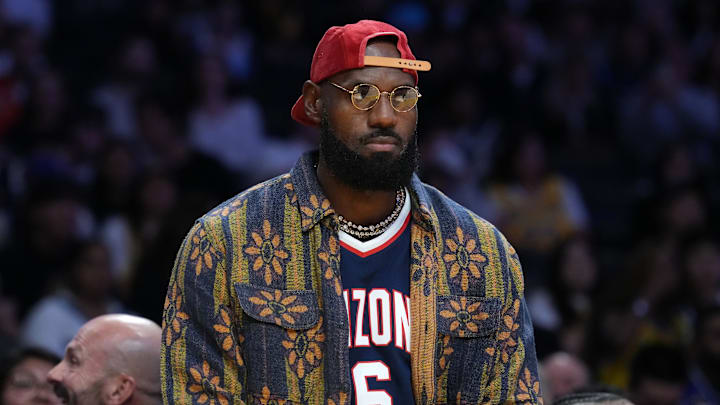 Oct 24, 2025; Los Angeles, California, USA; Los Angeles Lakers forward LeBron James wears the Arizona Wildcats jersey of his son Bryce James (6) during the game against the Minnesota Timberwolves at Crypto.com Arena. Mandatory Credit: Kirby Lee-Imagn Images