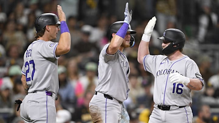 Sep 12, 2025; San Diego, California, USA; Colorado Rockies first baseman Blaine Crim (16) is congratulated by Hunter Goodman (15) and Jordan Beck (27) after hitting a three-run home run during the fourth inning against the San Diego Padres at Petco Park. Mandatory Credit: Denis Poroy-Imagn Images