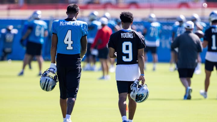 Jul 26, 2025; Charlotte, NC, USA; Carolina Panthers wide receiver Tetairoa McMillan (4) and quarterback Bryce Young (9) talk as they head to stretch during training camp. Mandatory Credit: Scott Kinser-Imagn Images Jul 26, 2025; Charlotte, NC, USA; Carolina Panthers wide receiver Tetairoa McMillan (4) and quarterback Bryce Young (9) talk as they head to stretch during training camp. Mandatory Credit: Scott Kinser-Imagn Images
